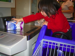 Child Operating Self Checkout