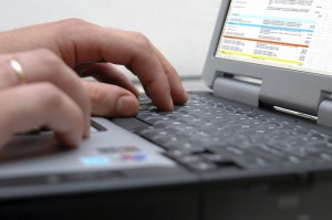 Man's hands on the keyboard of laptop