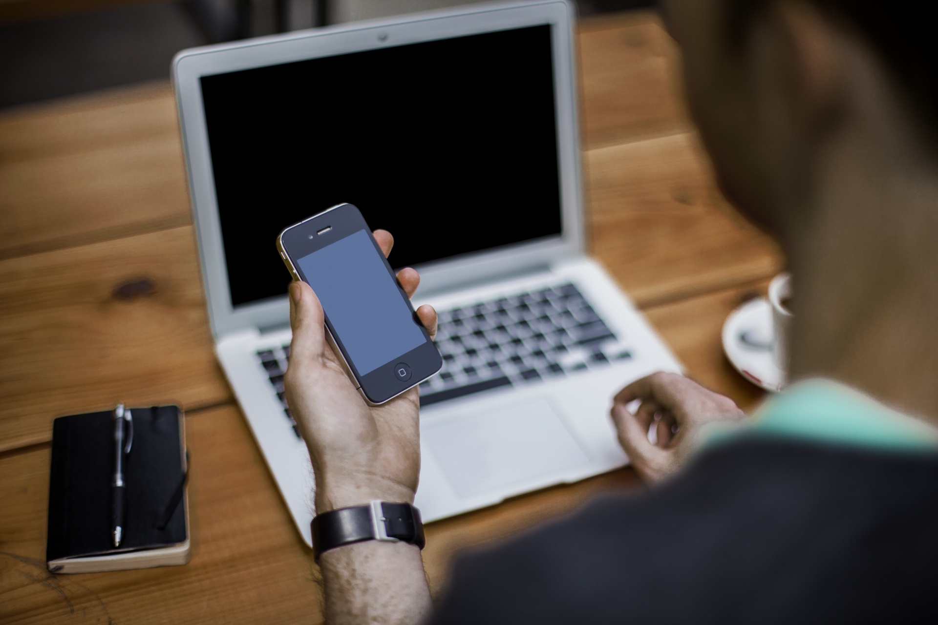 man with phone laptop