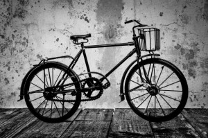 old-bicycle-on-a-wooden-floor-1393857695p5g