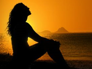 sillohette beach woman sunset alone isolation peace
